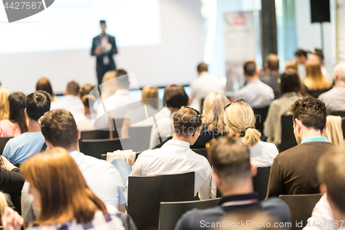 Image of Business speaker giving a talk at business conference event.