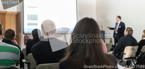 Image of Business speaker giving a talk at business conference event.