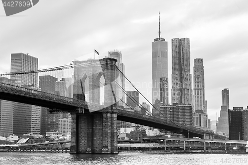 Image of Brooklyn Bridge and Manhattan skyline in black and white, New York, USA.