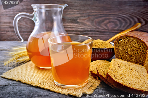 Image of Kvass in glassware on dark board