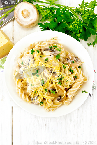 Image of Fusilli with mushrooms on board top