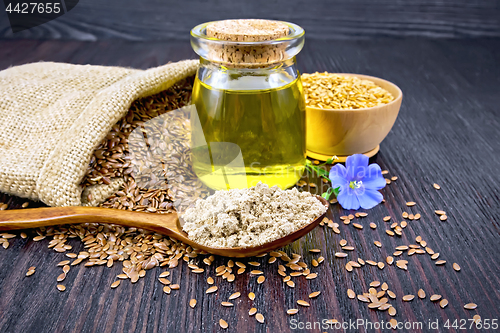 Image of Flour linen in spoon with oil and seeds on board