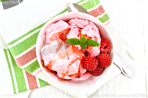 Image of Ice cream crimson with syrup on light board top