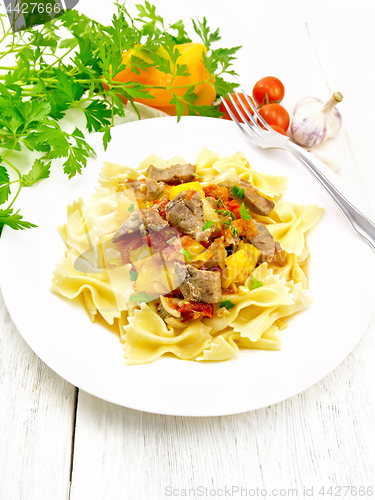 Image of Farfalle with turkey and vegetables on board