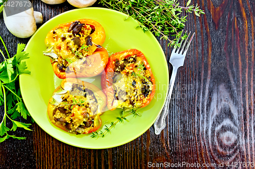 Image of Pepper with mushrooms and couscous in green plate top