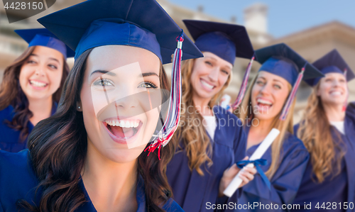 Image of Happy Graduating Group of Girls In Cap and Gown Celebrating on C