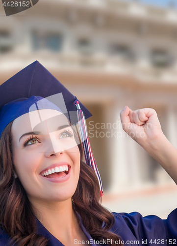 Image of Happy Graduating Mixed Race Woman In Cap and Gown Celebrating on