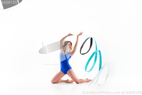 Image of The portrait of beautiful woman gymnast on white