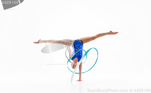 Image of The portrait of beautiful woman gymnast on white