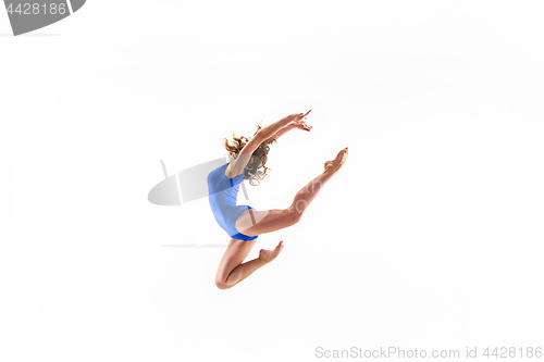 Image of young sporty woman doing acrobatic exercise