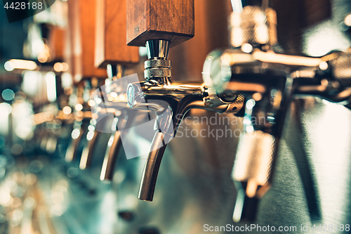 Image of Beer taps in a pub