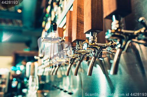 Image of Beer taps in a pub