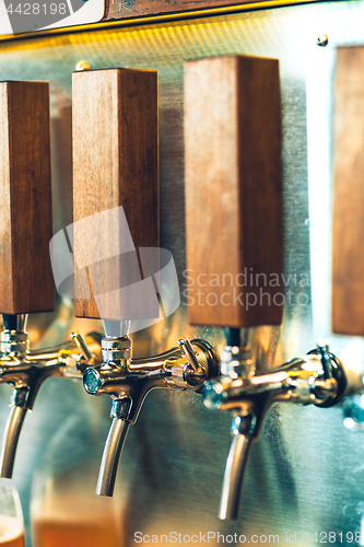 Image of Beer taps in a pub