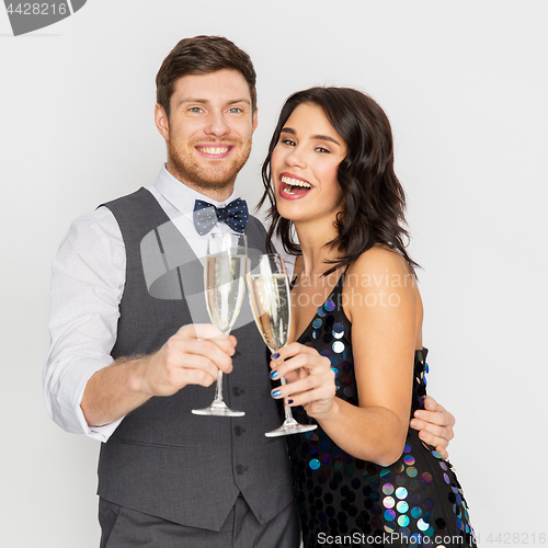 Image of happy couple with champagne glasses at party