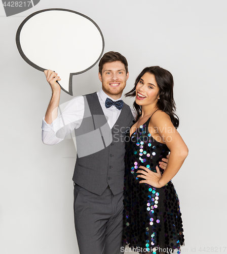 Image of happy couple at party holding text bubble banner