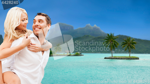 Image of happy couple over bora bora background