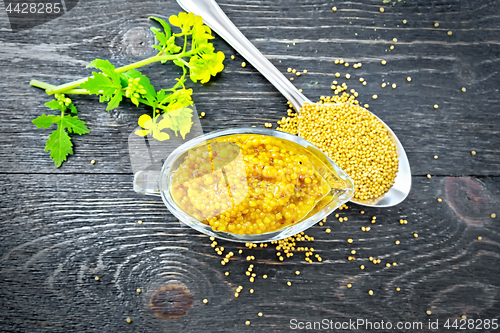 Image of Sauce mustard Dijon in sauceboat with flower on board top