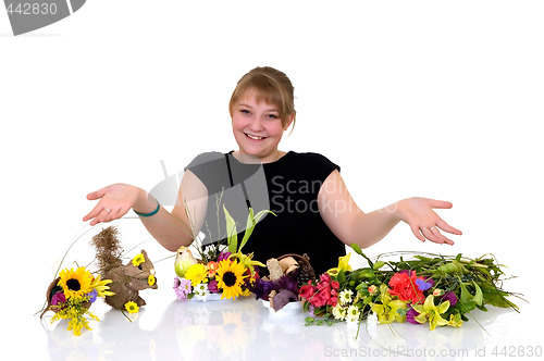 Image of Young girl arranging flowers