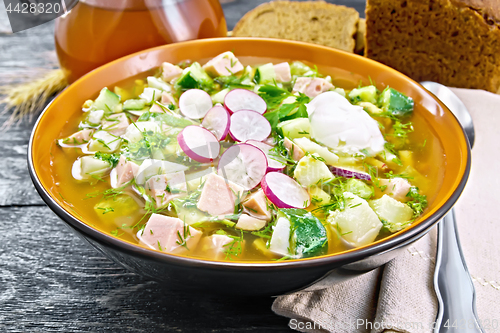 Image of Okroshka in bowl with napkin on board