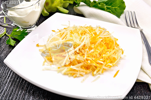 Image of Salad of carrot and kohlrabi on dark board