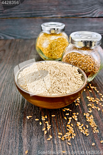 Image of Flour linen in bowl with seeds in jars on table