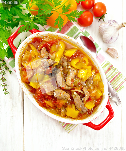 Image of Ragout of meat and vegetables in brazier on light board top