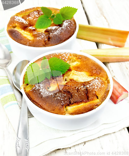 Image of Klafuti with rhubarb in bowl on wooden table