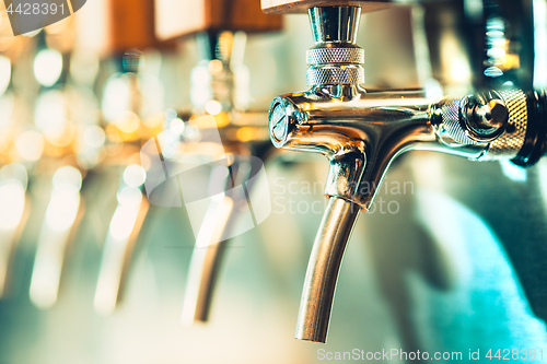 Image of Beer taps in a pub