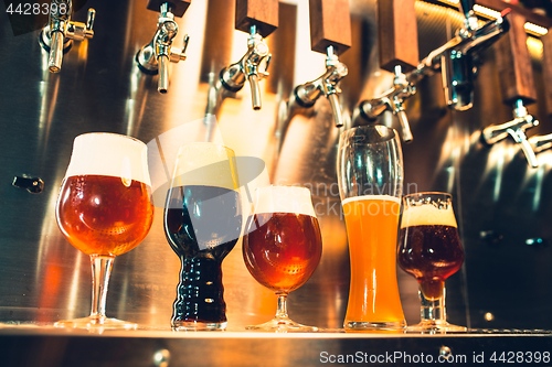 Image of Beer taps in a pub