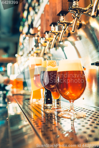 Image of Beer taps in a pub