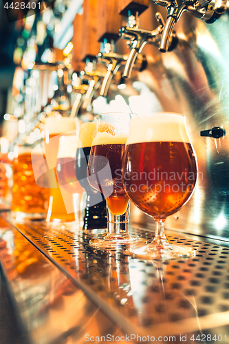 Image of Beer taps in a pub