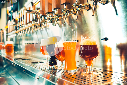 Image of Beer taps in a pub