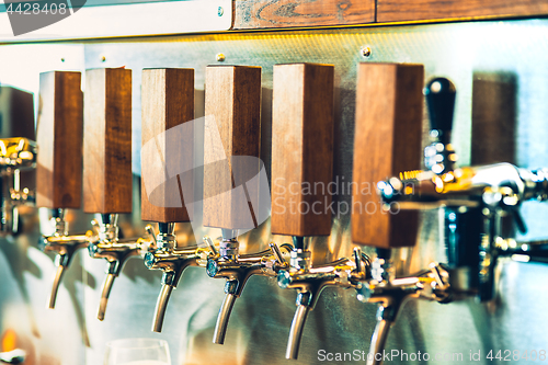 Image of Beer taps in a pub