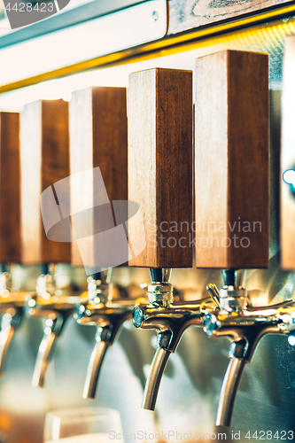 Image of Beer taps in a pub