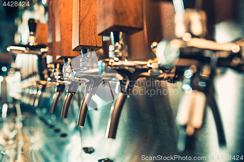 Image of Beer taps in a pub