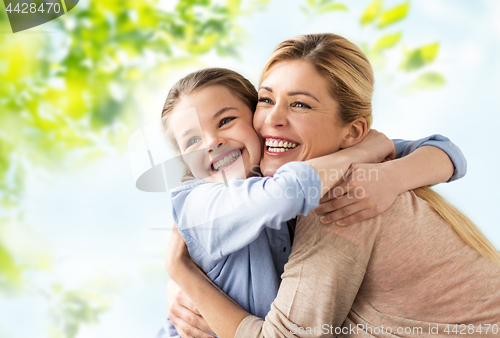 Image of happy smiling mother hugging daughter
