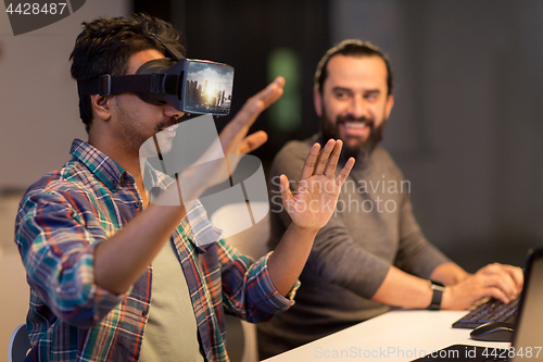 Image of developers with virtual reality headset at office