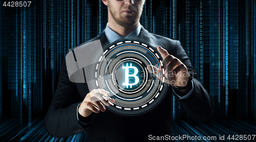 Image of close up of businessman with bitcoin hologram