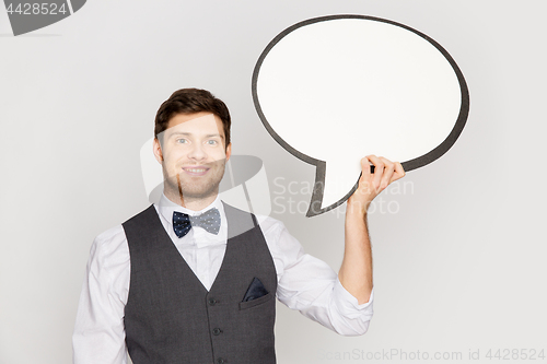 Image of happy man in suit holding blank text bubble banner