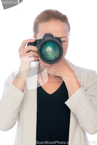 Image of Female photographer takes images with dslr camera