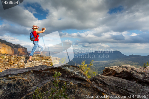 Image of Tourist taking photos of stunning Blue Mountain vistas