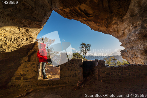 Image of Female looking out from cave Blue Mountains Australia