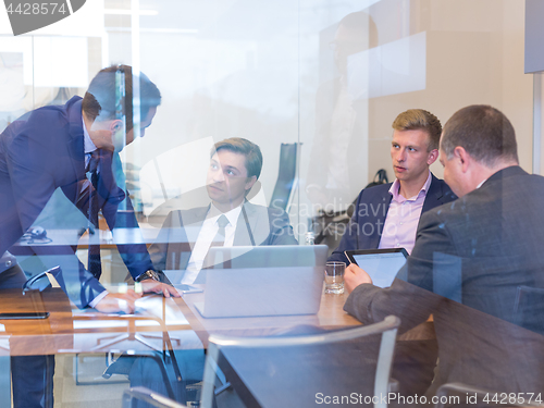 Image of Business people sitting and brainstorming at corporate meeting.