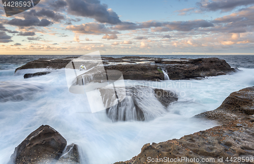 Image of Stranded  Rock Fisherman almost taken by the ocean