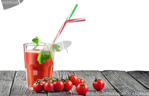 Image of Cherry tomatoes with glass of tomato juice