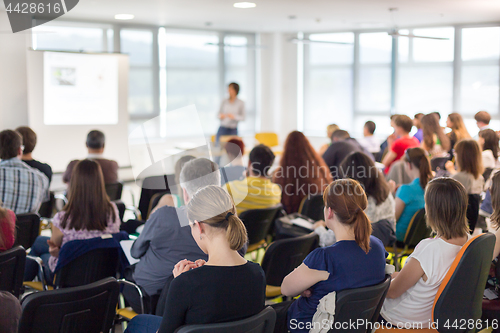 Image of Speaker giving presentation on business conference.