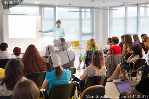 Image of Speaker giving presentation on business conference.