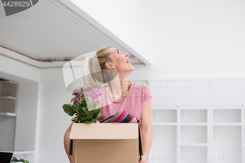 Image of girl moving in the new apartment