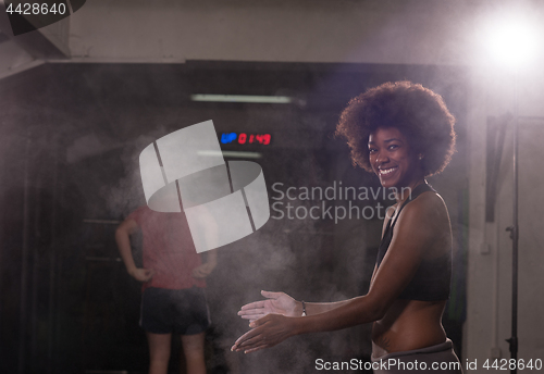 Image of black woman preparing for climbing workout