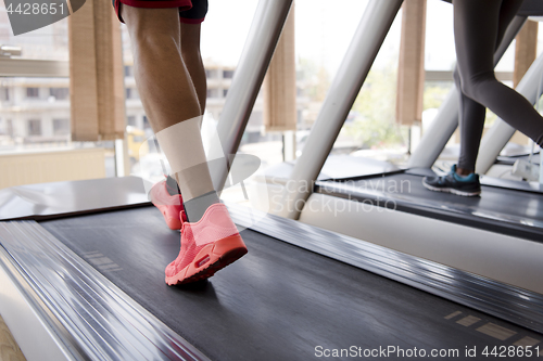 Image of sportsman exercise jogging on treadmill